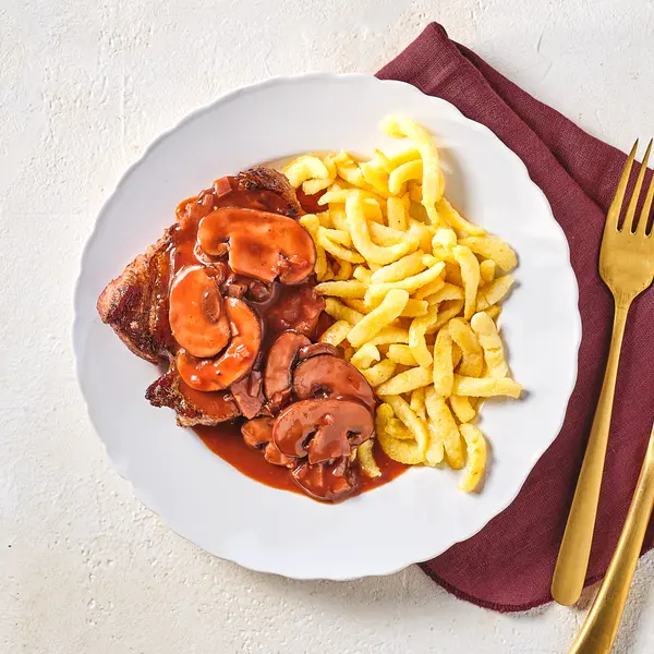 Iberico-Schwein mit Champignon-Rotweinsoße