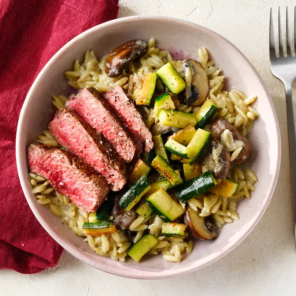 Cremige Kritharaki mit Filetstreifen